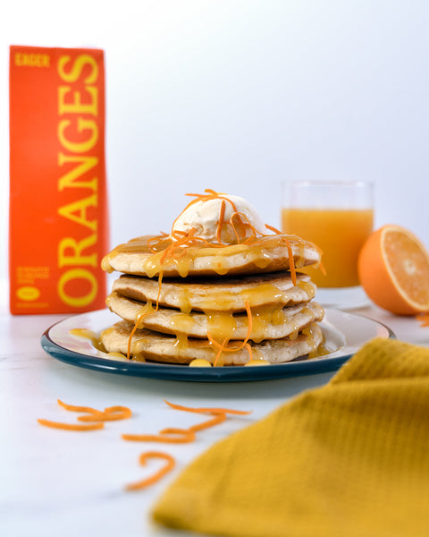 Pancakes with orange syrup and vanilla ice cream